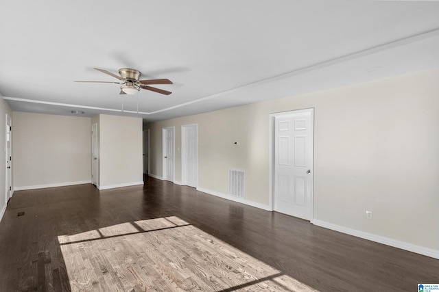 unfurnished room featuring dark hardwood / wood-style floors and ceiling fan