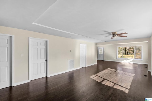 empty room featuring dark hardwood / wood-style floors and ceiling fan