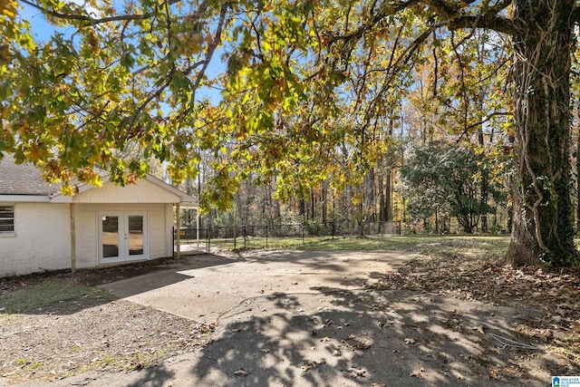 view of yard featuring french doors