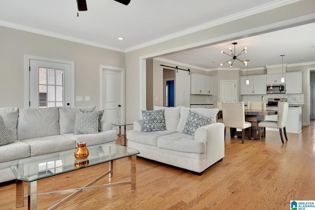 1114 Eagle Nest Cir, Birmingham, AL 35242 - living area with a barn door, light wood finished floors, a chandelier, ceiling fan, and crown molding