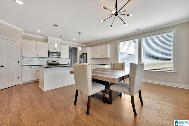 1114 Eagle Nest Cir, Birmingham, AL 35242 - dining space featuring a chandelier, light wood-style floors, crown molding, recessed lighting, and baseboards