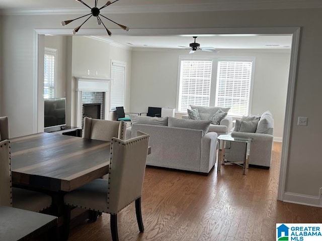 dining room with a chandelier, dark hardwood / wood-style flooring, and crown molding