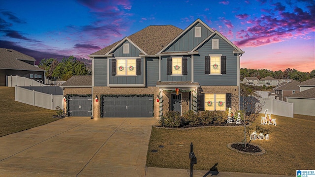 view of front facade featuring a lawn and a garage