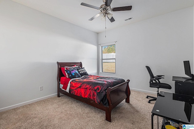 bedroom with ceiling fan and light carpet