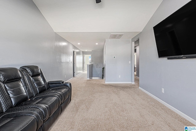 carpeted living room with lofted ceiling