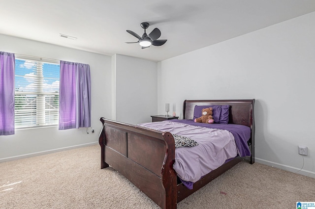 bedroom with ceiling fan and light colored carpet