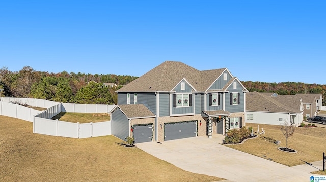 view of front facade featuring a front lawn and a garage