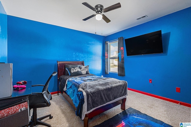 carpeted bedroom with ceiling fan