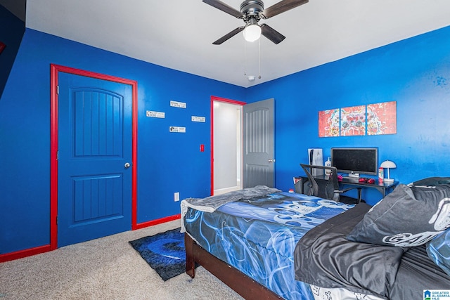 bedroom featuring ceiling fan and carpet