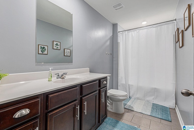 bathroom with tile patterned flooring, vanity, toilet, and a shower with curtain