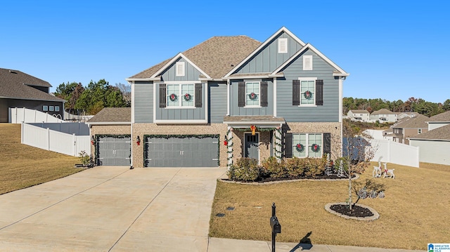 view of front facade featuring a front lawn and a garage