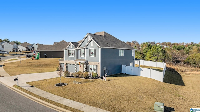 view of front of property with a front yard and a garage