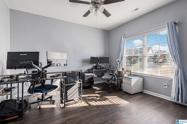 home office with ceiling fan and dark hardwood / wood-style floors