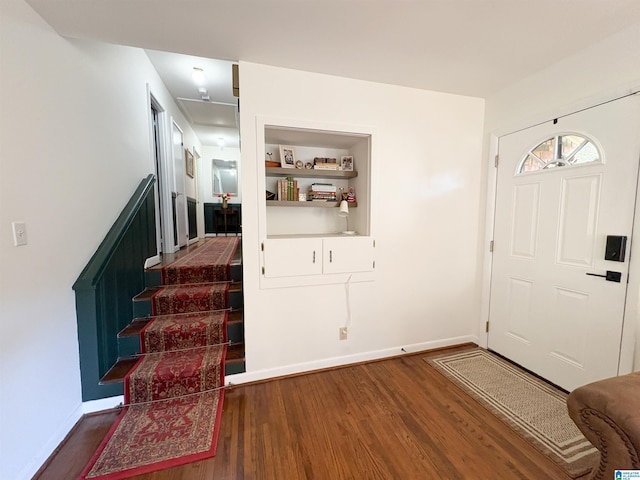 entrance foyer with dark hardwood / wood-style floors