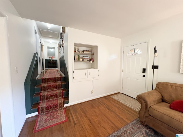 foyer entrance with dark hardwood / wood-style floors