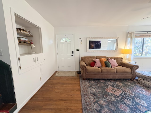 living room featuring dark wood-type flooring