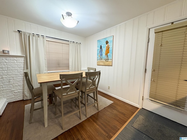 dining space featuring dark wood-type flooring