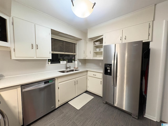 kitchen featuring white cabinetry, sink, and appliances with stainless steel finishes