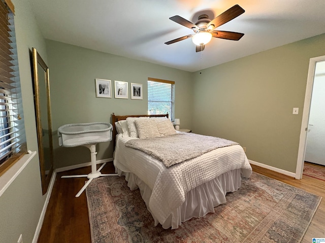 bedroom with ceiling fan and wood-type flooring