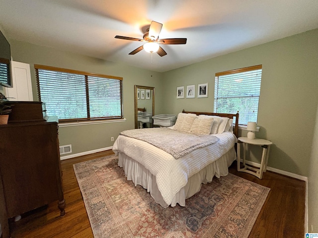 bedroom featuring dark hardwood / wood-style floors and ceiling fan