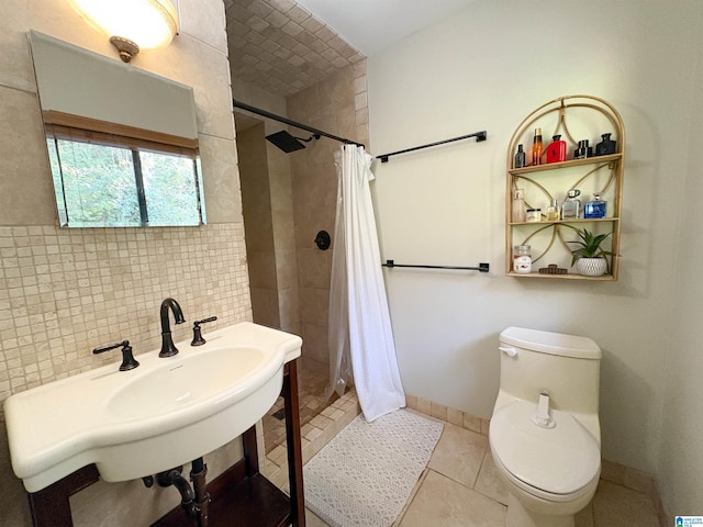 bathroom with sink, a shower with curtain, tile patterned floors, toilet, and decorative backsplash