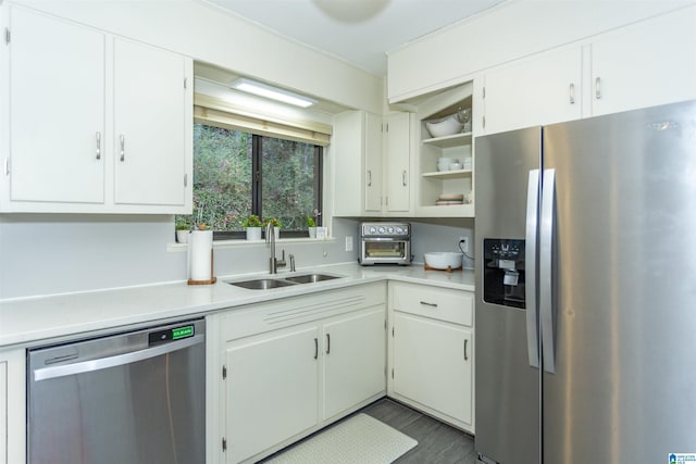 kitchen with white cabinets, sink, and appliances with stainless steel finishes