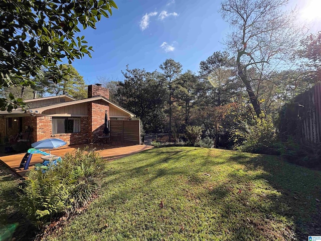 view of yard featuring a wooden deck