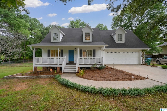 cape cod-style house featuring covered porch, a garage, and a front lawn