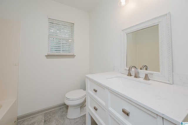 bathroom featuring vanity, toilet, and a bathtub