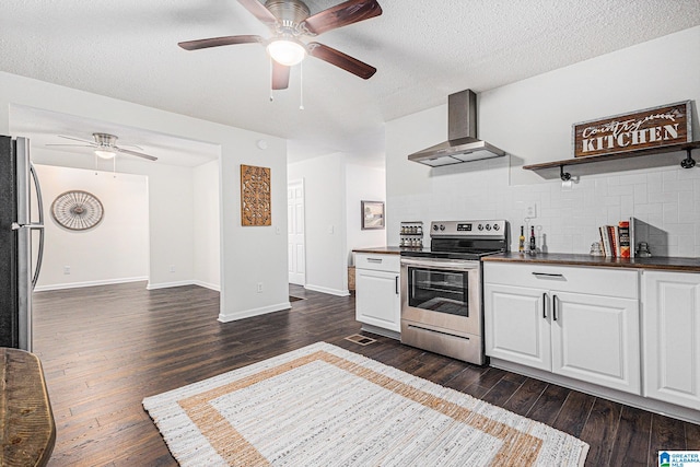 kitchen featuring dark wood-type flooring, wall chimney exhaust hood, and stainless steel appliances