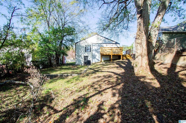 rear view of property featuring a deck