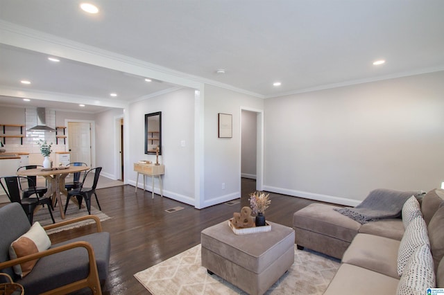 living room with hardwood / wood-style flooring and ornamental molding