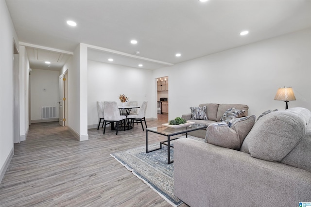 living room with light hardwood / wood-style flooring