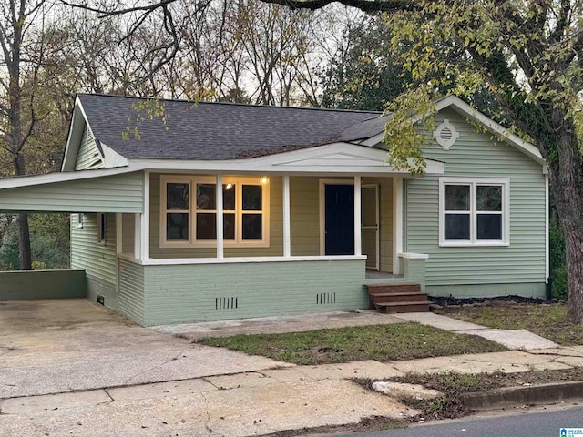 view of front facade featuring a porch and a carport