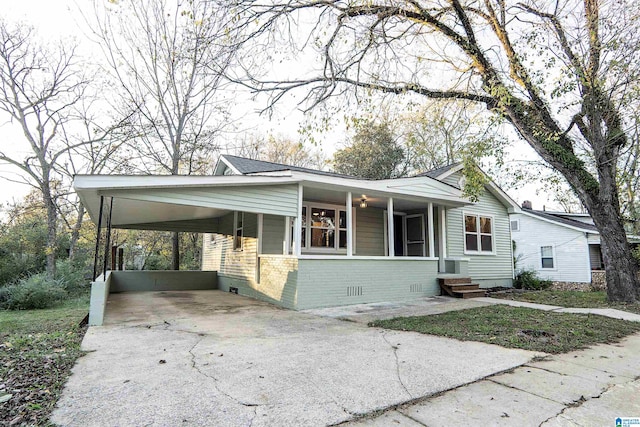 view of front of home with a carport