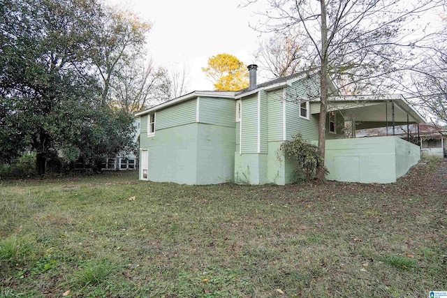 view of home's exterior with a yard