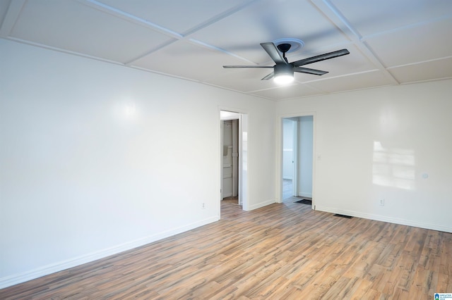 empty room with light hardwood / wood-style flooring and ceiling fan