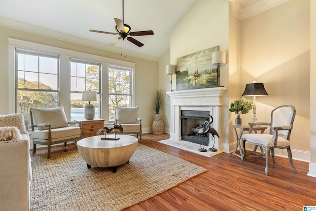 sitting room with ceiling fan, ornamental molding, and hardwood / wood-style flooring