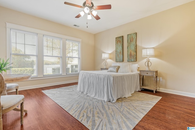 bedroom featuring ceiling fan and dark hardwood / wood-style floors