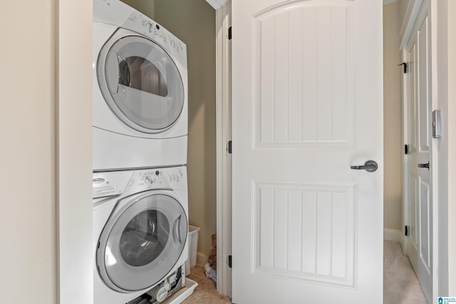 laundry room with stacked washer and clothes dryer