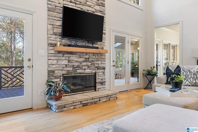 living room with a wealth of natural light and hardwood / wood-style flooring