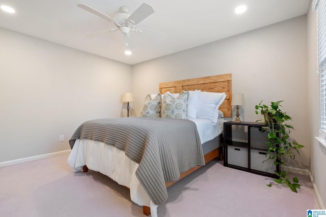 bedroom featuring light carpet and ceiling fan