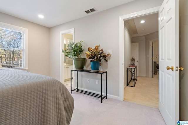 carpeted bedroom featuring ensuite bathroom