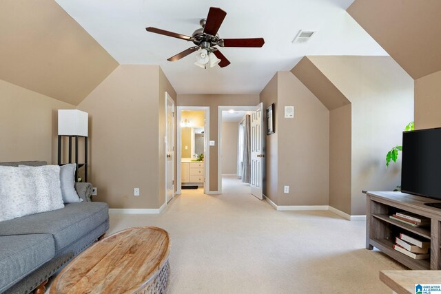 living room featuring light carpet, ceiling fan, and lofted ceiling