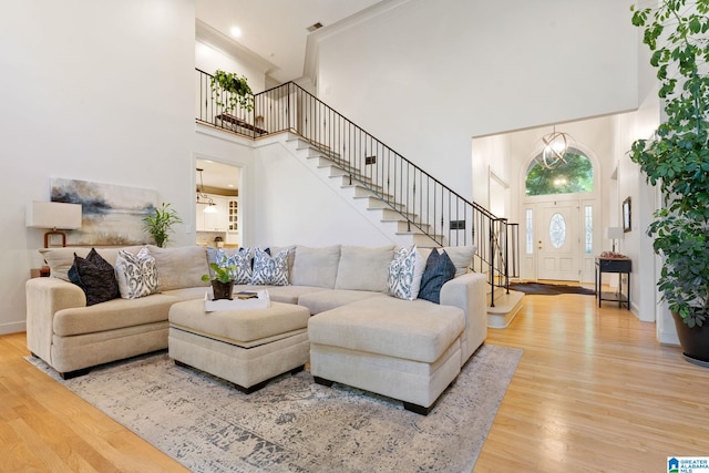 living room featuring hardwood / wood-style floors and a high ceiling