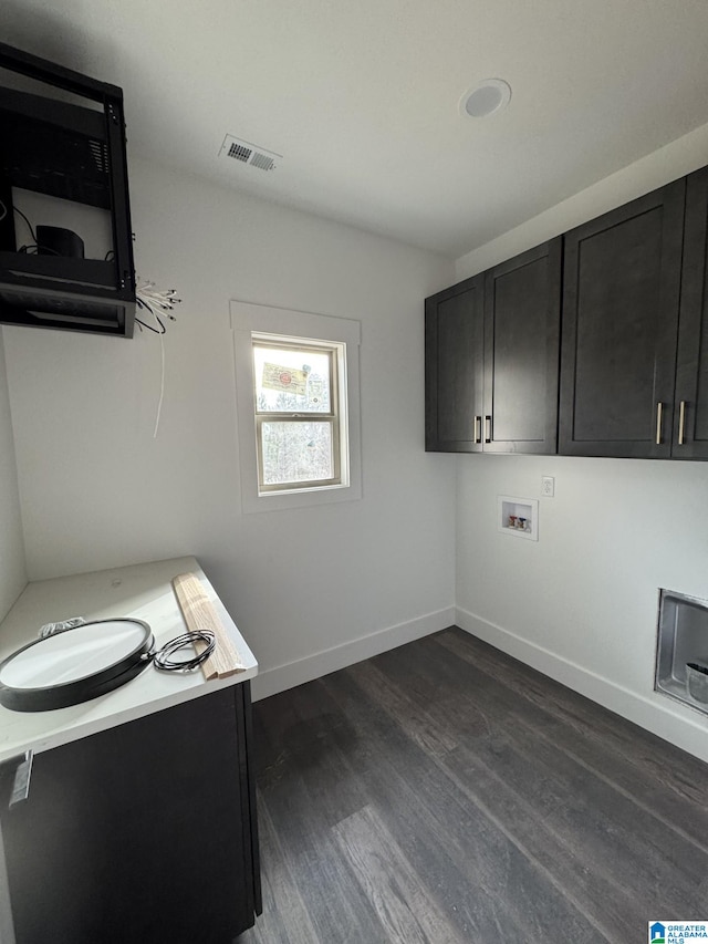 office space with dark wood-type flooring