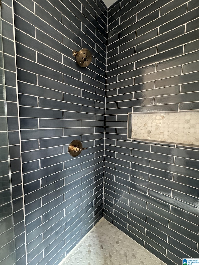 interior space featuring tiled shower