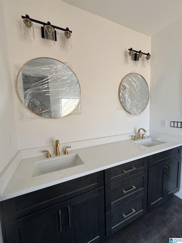 bathroom featuring vanity and hardwood / wood-style flooring