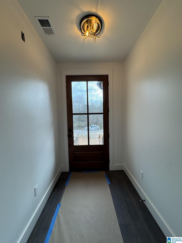 doorway featuring dark hardwood / wood-style flooring