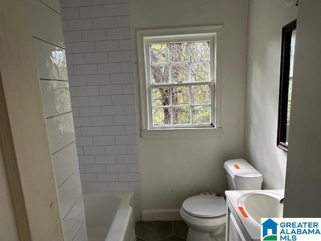 full bathroom featuring tile patterned floors, vanity, toilet, and independent shower and bath